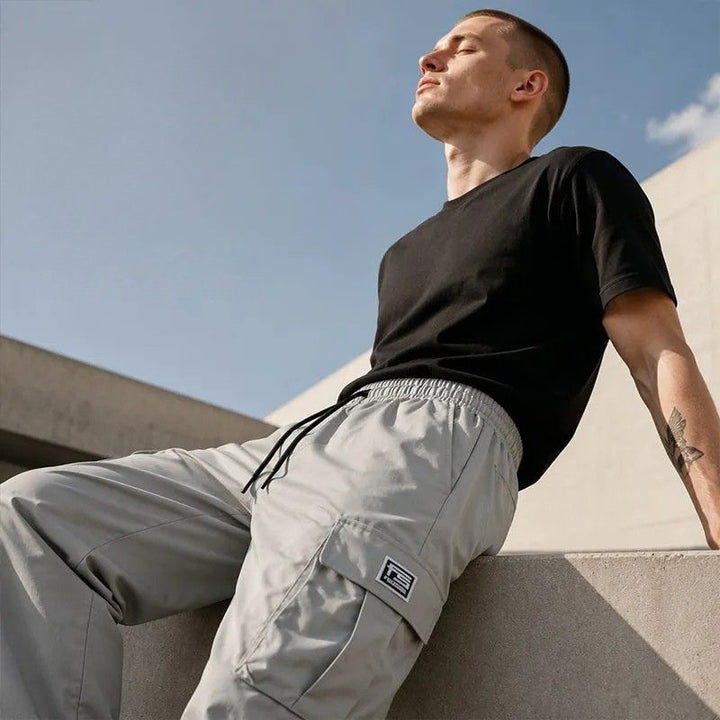 Nesham – Cargohose mit Kordelzug in der Taille und Taschen