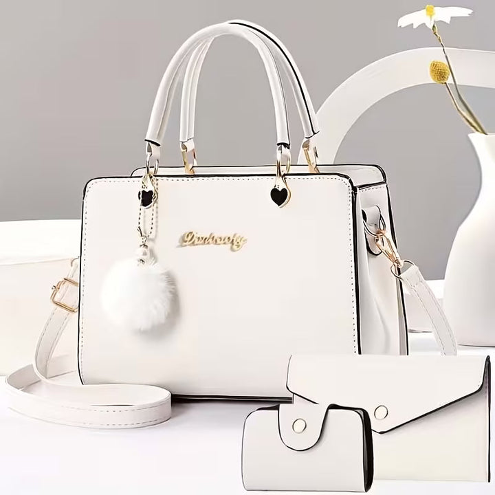 Sanika – Handtasche Mit Pompon Anhänger Und Schulterriemen